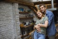 Happy young lovely couple in the kitchen hugging each other Royalty Free Stock Photo