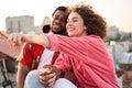 Happy young lovers cuddling on urban roof