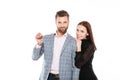 Happy young loving couple holding keys. Looking at camera. Royalty Free Stock Photo