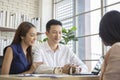 Happy young loving couple talking to their real estate agent with smile looking at house , Planning for the future of the family Royalty Free Stock Photo