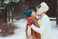 happy young loving couple walking in snowy winter forest, covered with snow Royalty Free Stock Photo