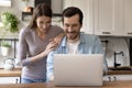 Happy young loving family couple looking at laptop screen. Royalty Free Stock Photo