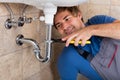 Male Plumber Repairing Sink In Bathroom Royalty Free Stock Photo