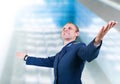 Happy young man aircraft pilot over glass modern building