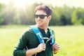 Happy young man with backpack hiking outdoors Royalty Free Stock Photo