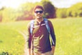 Happy young man with backpack hiking outdoors Royalty Free Stock Photo