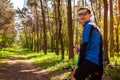 Happy young man bicyclist riding a road bike in spring forest. Man showing hand with thumb up. Royalty Free Stock Photo