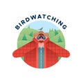 Birdwatching man with binoculars and bird isolated