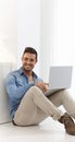Happy young man browsing internet at home Royalty Free Stock Photo
