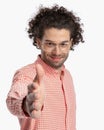 happy young man with curly hair wearing glasses and smiling Royalty Free Stock Photo