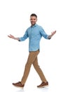 Happy young man in denim shirt smiling and opening arms Royalty Free Stock Photo