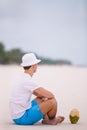 Young woman drinking coconut milk during tropical vacation Royalty Free Stock Photo