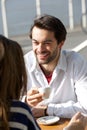 Happy young man drinking coffee with woman Royalty Free Stock Photo