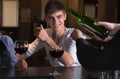 Happy young man drinking wine with friends Royalty Free Stock Photo