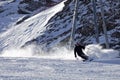 Happy young man enjoying winter vacations in mountains, Val Thorens, 3 Valleys, France. Playing with snow and sun in high mountain