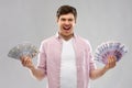 Happy young man with fans of euro and dollar money Royalty Free Stock Photo