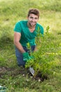 Happy young man gardening for the community Royalty Free Stock Photo