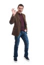 Happy young man gesturing OK sign Royalty Free Stock Photo