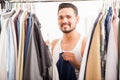 Happy young man getting dressed Royalty Free Stock Photo