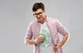 Happy young man in glasses with fan of euro money Royalty Free Stock Photo