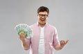Happy young man in glasses with fan of euro money Royalty Free Stock Photo