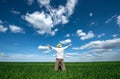 Happy young man on green field of wheat Royalty Free Stock Photo