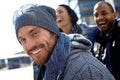 Happy young man in hat and scarf