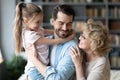 Happy loving multigenerational family communicating at home. Royalty Free Stock Photo