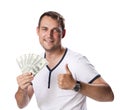 Happy young man holding a pile of cash