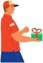 Happy young man holding purchase or present. Male courier delivers packed box of holiday gift Royalty Free Stock Photo