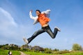 Happy young man - jumping end flies in blue sky. Royalty Free Stock Photo