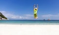 Back view of happy young man jumping with outstretched arms on the beach-Summer vacation concept Royalty Free Stock Photo