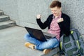 Happy young man with laptop computer. I did it!