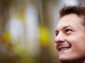 Happy young man looking up at copy space Royalty Free Stock Photo