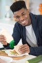 happy young man making perfect sandwich Royalty Free Stock Photo