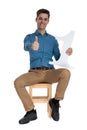 Happy young man making thumbs up sign and smiling Royalty Free Stock Photo