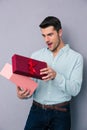 Happy young man opening gift box Royalty Free Stock Photo