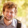 Happy young man outdoor portrait. Royalty Free Stock Photo