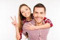 Happy young man piggybacking his girlfriend, close up photo Royalty Free Stock Photo