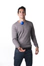 Happy young man playing with small rubber ball with smiley
