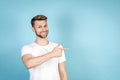 Happy young man pointing aside with finger Royalty Free Stock Photo