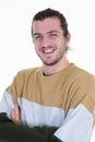 Happy young man portrait handsome guy in casual sweat shirt arms crossed smiling standing against white background Royalty Free Stock Photo