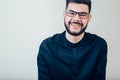 Happy young man. Portrait of handsome young man keeping arms crossed and smiling Royalty Free Stock Photo