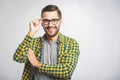 Happy young man. Portrait of handsome young man in casual shirt keeping arms crossed and smiling Royalty Free Stock Photo