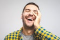 Happy young man. Portrait of handsome young man in casual shirt keeping arms crossed and smiling while standing Royalty Free Stock Photo