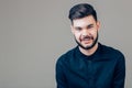 Happy young man. Portrait of handsome young man keeping arms crossed and smiling Royalty Free Stock Photo