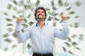 Happy young man in a rain of money Royalty Free Stock Photo