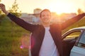 Happy young man raising his hands up and smiling Royalty Free Stock Photo