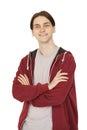 Happy young man in red hoody standing with crossed arms on white background Royalty Free Stock Photo