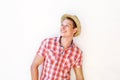 Happy young man in red shirt smiling with hat Royalty Free Stock Photo